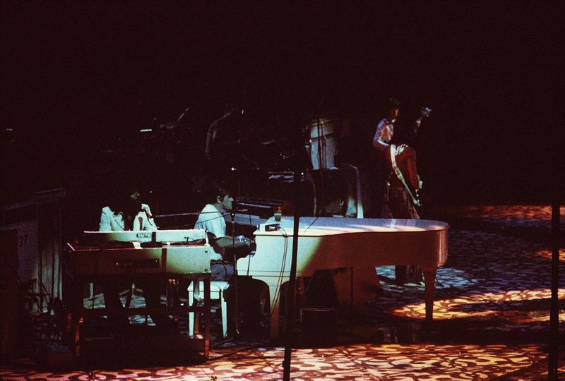 Ian Stewart (centre) and Billy Preston (left) performing with the Rolling Stones